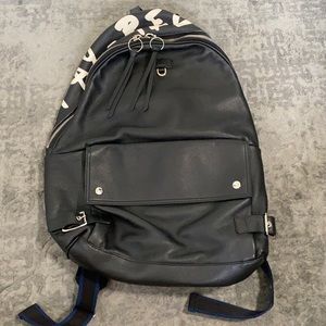Black stay reckless Furla backpack from retail store